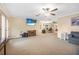 Open living area with hardwood floors and multiple seating areas at 1102 Rolling Acres Dr, Deland, FL 32720