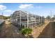 Screened pool enclosure offers privacy and shade at 1102 Rolling Acres Dr, Deland, FL 32720