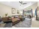 Living room with L-shaped sofa and sliding doors to patio at 137 Avalon Dr, Ormond Beach, FL 32176