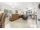 Living room with vaulted ceiling, patio doors and comfortable seating at 137 Avalon Dr, Ormond Beach, FL 32176