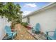 Landscaped side yard with stone path and seating area at 137 Avalon Dr, Ormond Beach, FL 32176