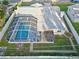 Aerial view showing house with screened pool and backyard at 1408 Ruthbern Rd, Daytona Beach, FL 32114