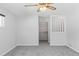 Spacious bedroom with a large closet and grey carpeting at 1408 Ruthbern Rd, Daytona Beach, FL 32114