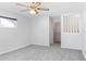 Bright bedroom featuring a large closet and grey carpet at 1408 Ruthbern Rd, Daytona Beach, FL 32114