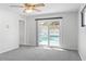 Bedroom with pool view and sliding glass doors at 1408 Ruthbern Rd, Daytona Beach, FL 32114