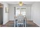 Bright dining room with wood-look flooring and sliding glass doors at 1408 Ruthbern Rd, Daytona Beach, FL 32114