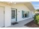 Charming front door entry with teal accents and a brick exterior at 1408 Ruthbern Rd, Daytona Beach, FL 32114