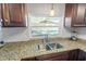 Updated kitchen with granite countertops and stainless steel appliances at 1408 Ruthbern Rd, Daytona Beach, FL 32114