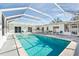 Inviting swimming pool with a covered patio perfect for relaxation at 1408 Ruthbern Rd, Daytona Beach, FL 32114