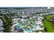 Aerial view of Storey Lake community, featuring a resort-style pool, lazy river, and numerous homes at 3161 Paradox Cir # 303, Kissimmee, FL 34746