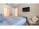 Comfortable bedroom with a plush bed and relaxing sitting area at 3161 Paradox Cir # 303, Kissimmee, FL 34746