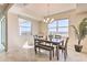 Bright dining room with view and seating for six at 3161 Paradox Cir # 303, Kissimmee, FL 34746