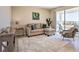 Living room with sectional sofa and access to balcony at 3161 Paradox Cir # 303, Kissimmee, FL 34746