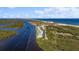 Aerial view of waterfront community with ocean access, lush landscaping, and multiple buildings at 41 Ocean Palm Villa S # 41, Flagler Beach, FL 32136