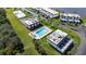 Aerial view of community pool and surrounding condo buildings at 41 Ocean Palm Villa S # 41, Flagler Beach, FL 32136