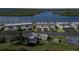 Aerial view of waterfront community, tennis court, and parking at 41 Ocean Palm Villa S # 41, Flagler Beach, FL 32136