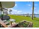 Waterfront patio with seating and river views at 41 Ocean Palm Villa S # 41, Flagler Beach, FL 32136