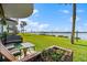 Relaxing patio overlooking waterfront with lush lawn at 41 Ocean Palm Villa S # 41, Flagler Beach, FL 32136