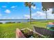 Relaxing patio view of waterfront and passing sailboat at 41 Ocean Palm Villa S # 41, Flagler Beach, FL 32136