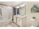 Bathroom with a bathtub, double vanity, and shower at 4741 Clock Tower Dr # 105, Kissimmee, FL 34746