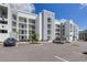 Modern apartment building with parking and landscaped grounds at 4741 Clock Tower Dr # 105, Kissimmee, FL 34746