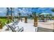 Relaxing poolside space with lounge chairs and sand at 4741 Clock Tower Dr # 105, Kissimmee, FL 34746