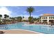 Resort-style pool with plenty of lounge chairs at 4741 Clock Tower Dr # 105, Kissimmee, FL 34746