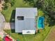 Single story home with metal roof and pool at 6 Baytree Cir, Ormond Beach, FL 32176