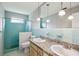 Bathroom with a teal shower and double vanity at 6 Baytree Cir, Ormond Beach, FL 32176