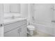 Clean bathroom, bathtub, toilet and gray vanity at 1702 Myrtlebrooke Dr, Edgewater, FL 32141