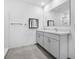 Modern bathroom with double vanity and large mirror at 1702 Myrtlebrooke Dr, Edgewater, FL 32141