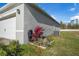 Side view of house showcasing garage and landscaping at 1702 Myrtlebrooke Dr, Edgewater, FL 32141