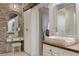 Vanity with stone sink and built-in shelving in a bathroom at 2627 John Anderson Dr, Ormond Beach, FL 32176