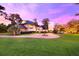 Elegant home exterior with a circular driveway and manicured lawn at 2627 John Anderson Dr, Ormond Beach, FL 32176