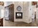 Stone fireplace is a focal point in this open kitchen and living area at 2627 John Anderson Dr, Ormond Beach, FL 32176