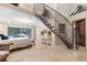 Main bedroom with a king-size bed and spiral staircase at 2627 John Anderson Dr, Ormond Beach, FL 32176