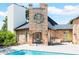 Outdoor kitchen and dining area adjacent to a luxurious brick home at 2627 John Anderson Dr, Ormond Beach, FL 32176