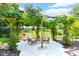 Charming pergola covered in lush vines provides a relaxing outdoor space at 2627 John Anderson Dr, Ormond Beach, FL 32176