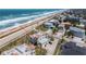 Aerial view of beach house near the ocean and other homes at 3072 Ocean Shore Blvd, Ormond Beach, FL 32176