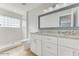 Double vanity bathroom with granite countertops at 3072 Ocean Shore Blvd, Ormond Beach, FL 32176