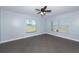 Bright bedroom with ceiling fan and large windows at 3072 Ocean Shore Blvd, Ormond Beach, FL 32176