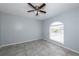 Bright bedroom with tile floors and large window at 3072 Ocean Shore Blvd, Ormond Beach, FL 32176