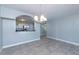 Bright dining room with tile floors and kitchen view at 3072 Ocean Shore Blvd, Ormond Beach, FL 32176