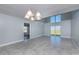 Dining room with high ceilings and sliding glass doors at 3072 Ocean Shore Blvd, Ormond Beach, FL 32176