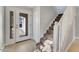 Bright entryway with staircase, light gray walls, and white door at 3072 Ocean Shore Blvd, Ormond Beach, FL 32176