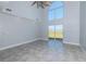 Living room with high ceilings, tile floors, and sliding doors at 3072 Ocean Shore Blvd, Ormond Beach, FL 32176