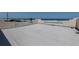 Empty rooftop deck with ocean views and white balustrades at 3072 Ocean Shore Blvd, Ormond Beach, FL 32176