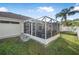 Screened porch and patio area in a well-maintained backyard at 35 Saddlers Run, Ormond Beach, FL 32174