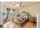 Spacious bedroom with large bed, wood floors, and ample natural light at 35 Saddlers Run, Ormond Beach, FL 32174