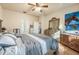 Primary bedroom with king-size bed and en-suite bathroom access at 35 Saddlers Run, Ormond Beach, FL 32174